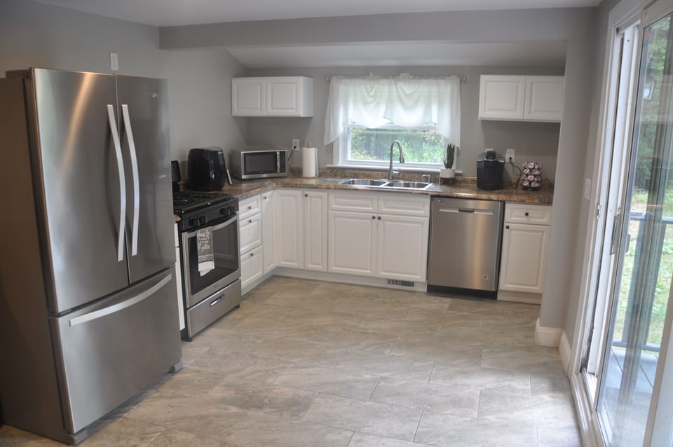 French door fridge, gas stove, double sink, pull down faucet, dishwasher
