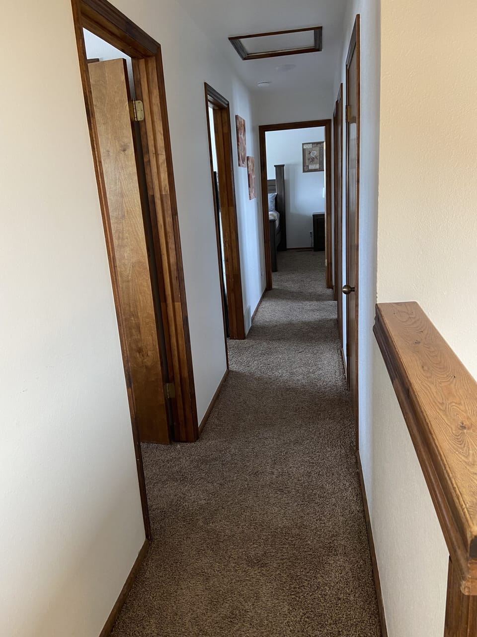 Upstairs hallway leading to the bedrooms and main bathroom