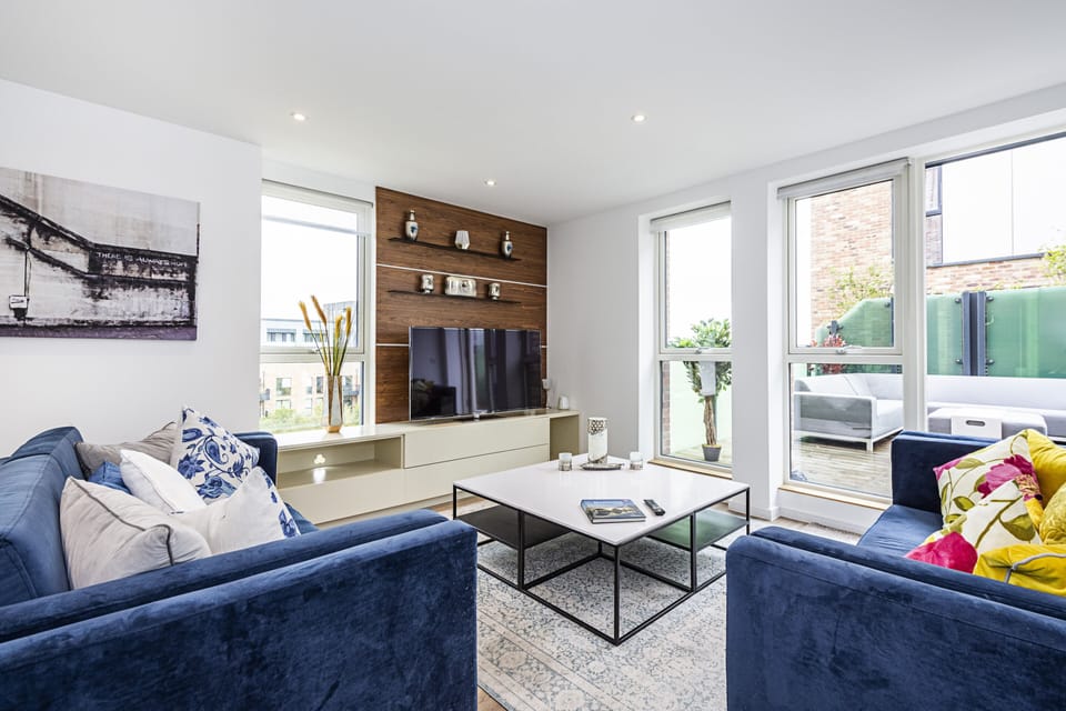 Three-Bedroom Apartment | Living room | 55-inch LED TV with digital channels, TV