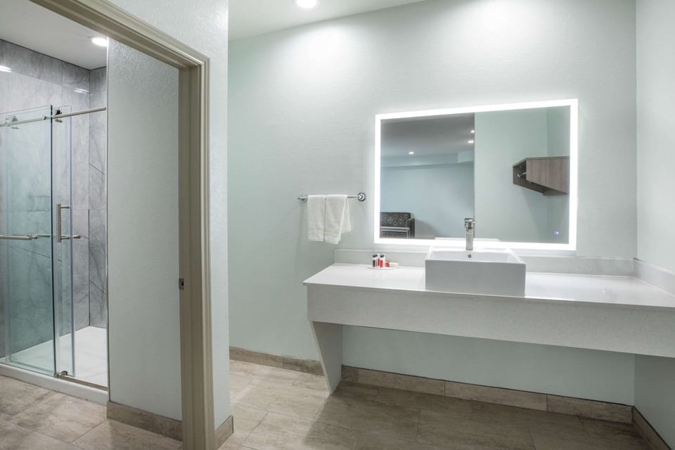 Combined shower/tub, hair dryer, towels, soap