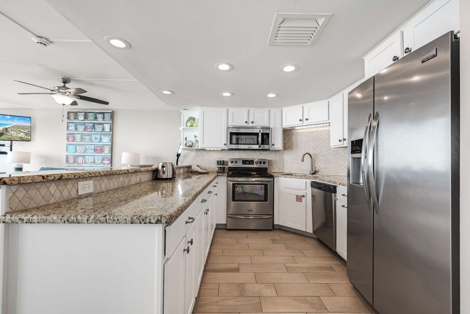 Well stocked kitchen with new appliances.