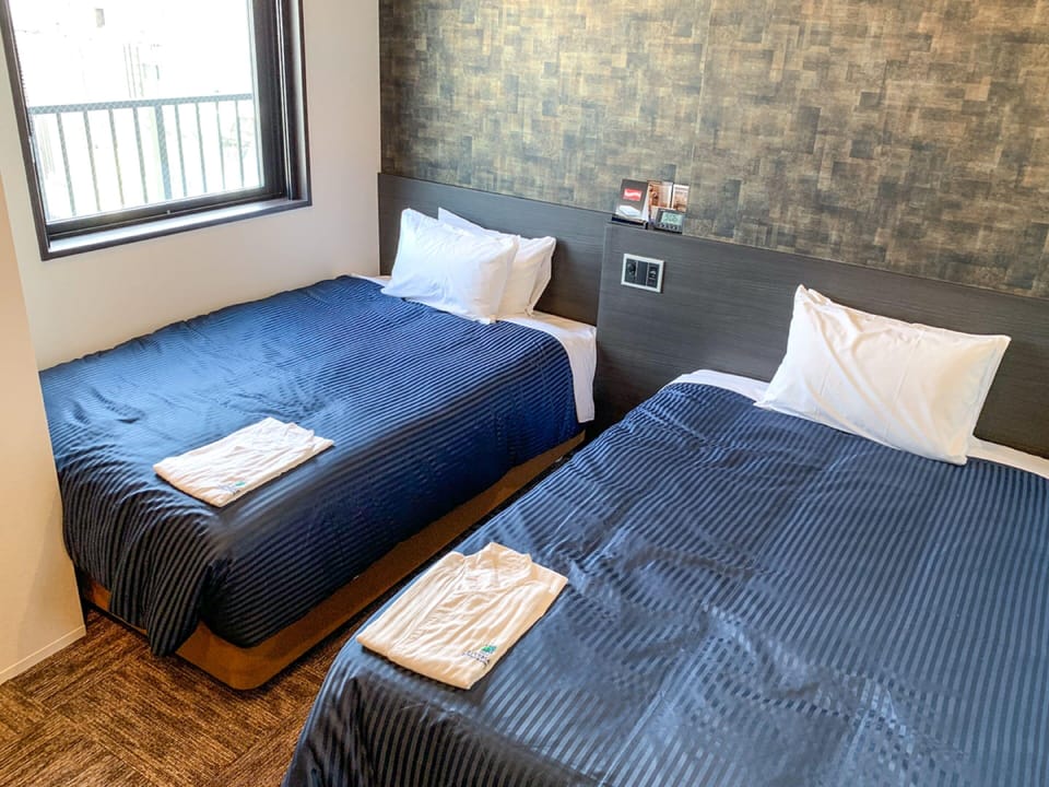 Desk, laptop workspace, free WiFi, bed sheets