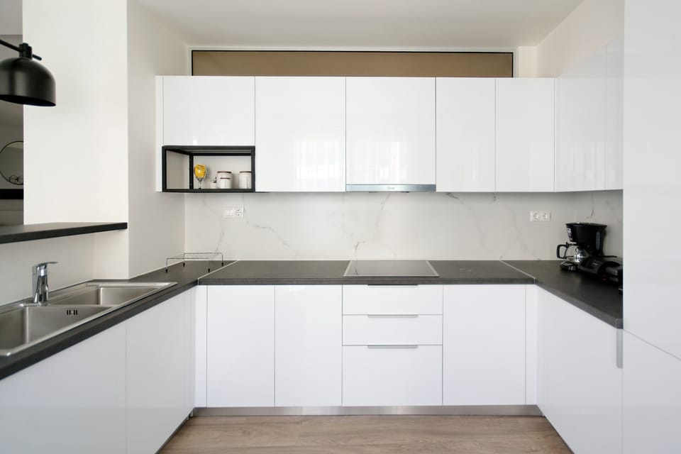 Deluxe Apartment, 4 Bedrooms, Balcony | Private kitchen | Espresso maker, coffee/tea maker, full-size fridge, microwave