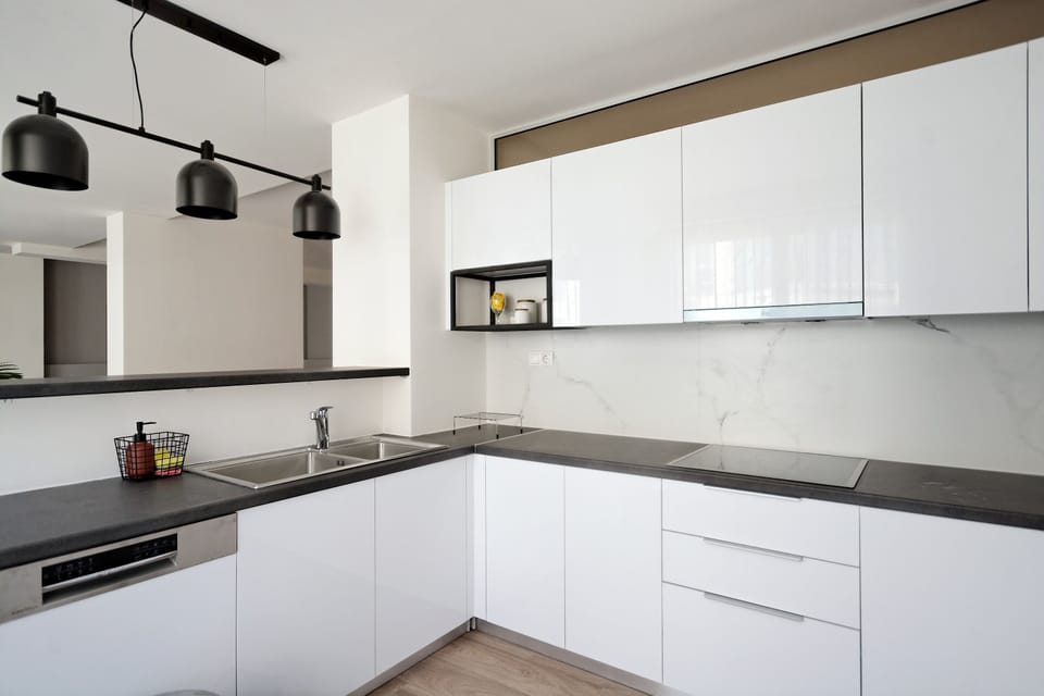 Deluxe Apartment, 4 Bedrooms, Balcony | Private kitchen | Espresso maker, coffee/tea maker, full-size fridge, microwave