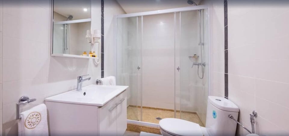 Shower, rainfall showerhead, hair dryer, towels