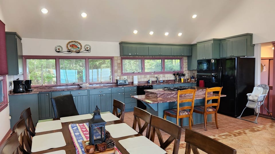 Kitchen with granite countertops, gas cooktop, additional eating area