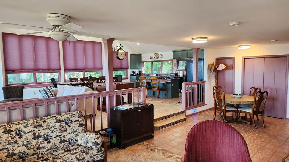View from family room looking back towards kitchen, living, & dining room
