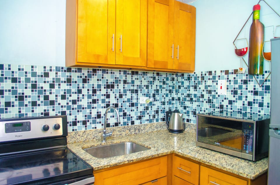 Apartment, Non Smoking | Private kitchen | Full-size fridge, microwave, oven, stovetop