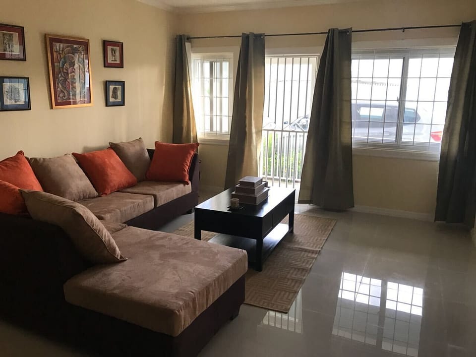 Family Apartment, Non Smoking | Living area | 50-inch flat-screen TV with cable channels, TV, DVD player