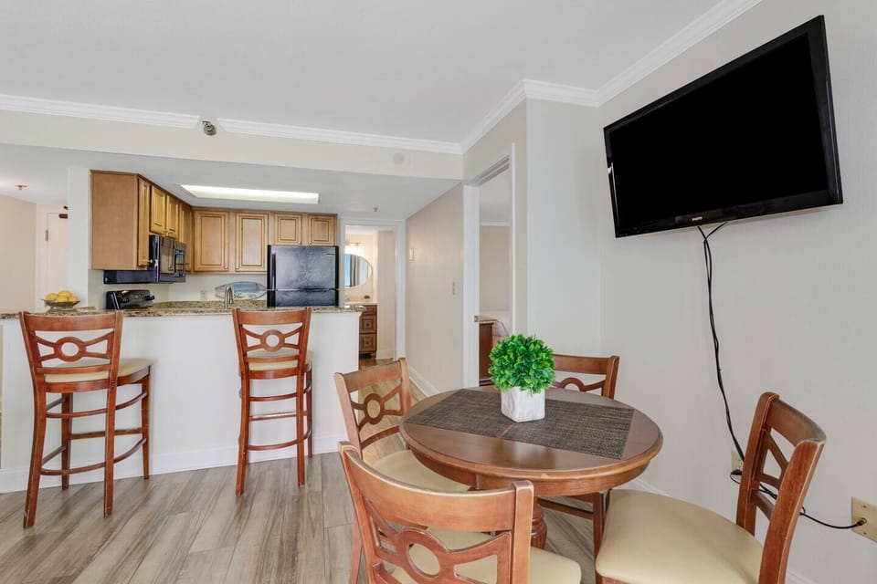 Delight in a leisurely brunch in our suite's dining area, a comfortable nook bathed in morning sunlight, perfect for a relaxed and enjoyable meal.