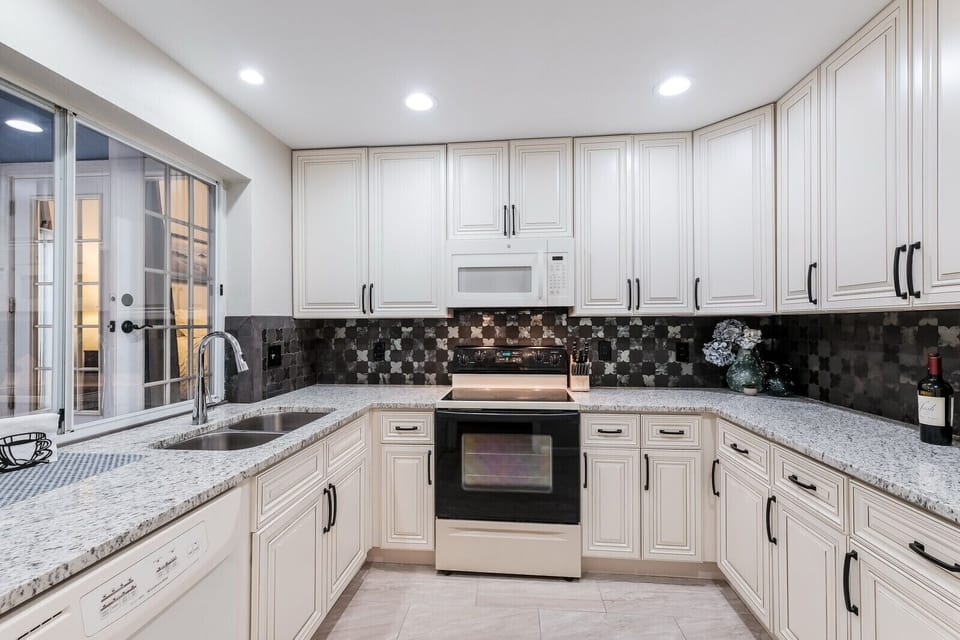 Bright modern kitchen stocked with essentials you'll need