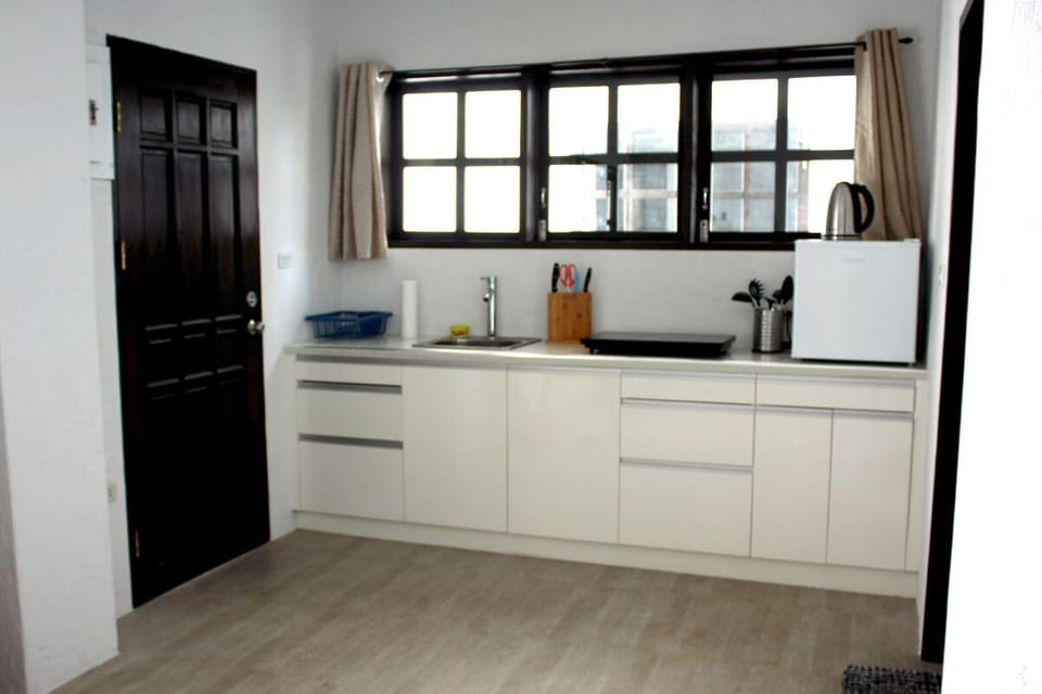 Studio (R6 1F) | Private kitchenette | Electric kettle, cleaning supplies, dining tables