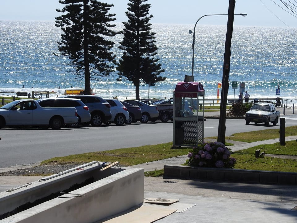 View from the cottage to the street and patrolled beach.