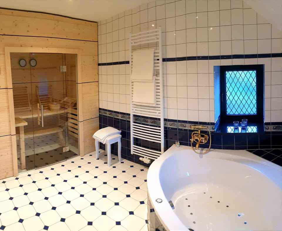 Deluxe Suite, Hot Tub (Adults Only) | Bathroom amenities | Designer toiletries, hair dryer, bathrobes, slippers