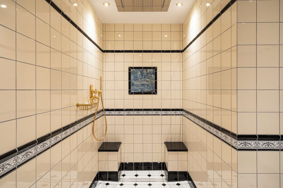 Exclusive Suite | Bathroom | Designer toiletries, hair dryer, bathrobes, slippers