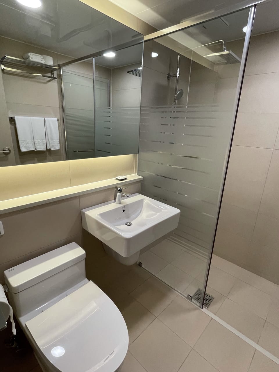 Shower, rainfall showerhead, hair dryer, towels