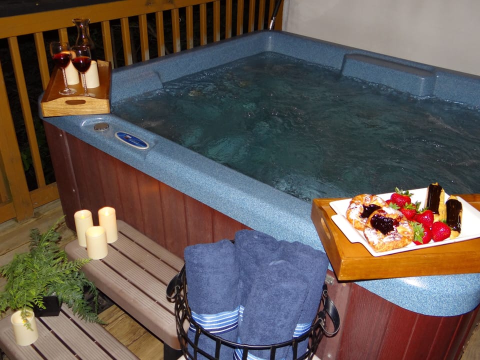 Relax in the hot tub on the back deck downstairs with privacy of curtains.