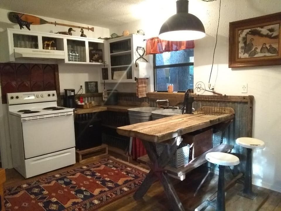 Great repurposed items in the kitchen plus stove, fridge, k-cup, and microwave