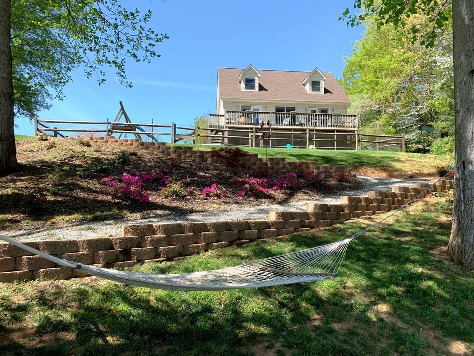 View of house from cove on east side of house (old fence shown in picture).