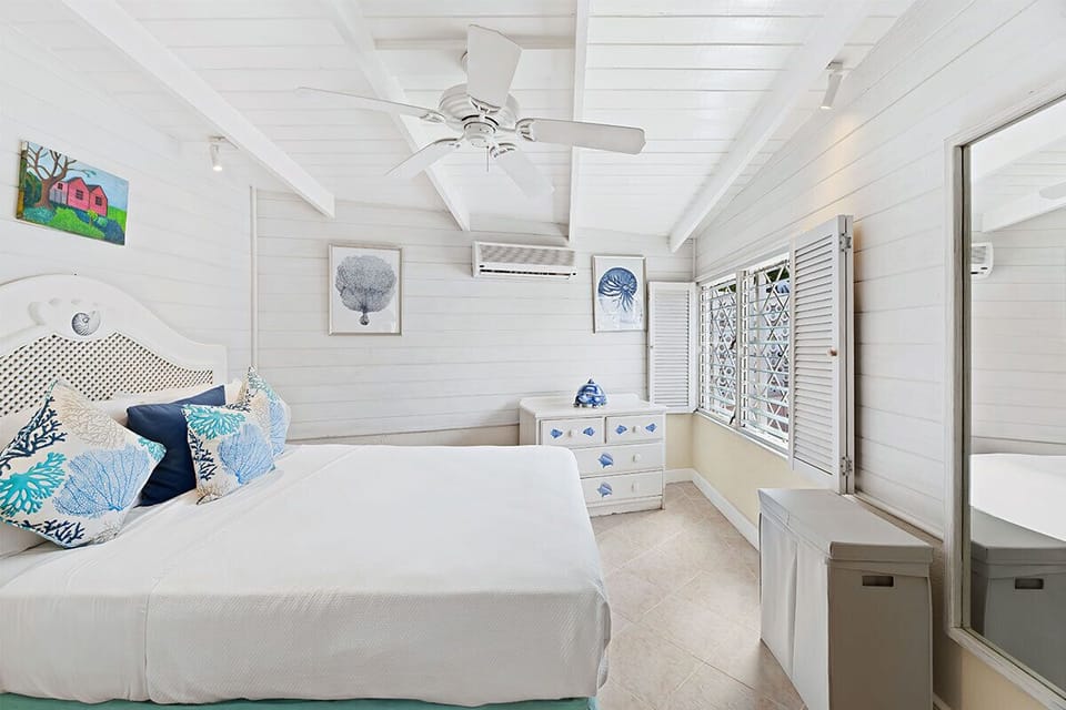 Second bedroom at the cottage with a queen bed and A/C