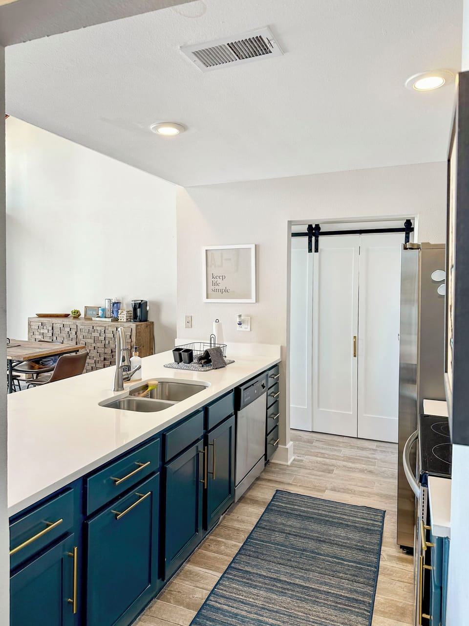 fully stocked kitchen with, crockpot, blender, toaster and Keurig coffee
