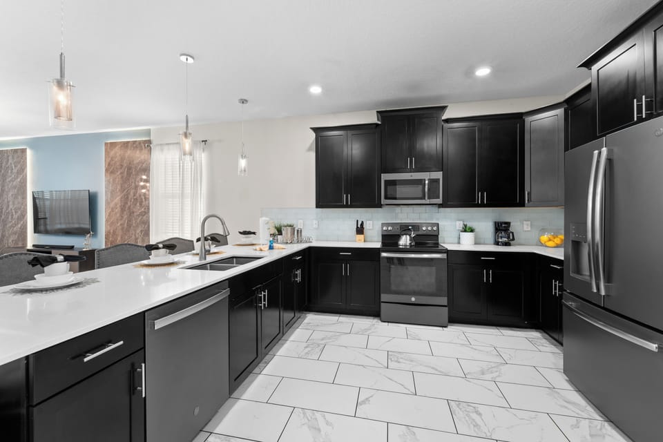 Gleaming countertops and stainless appliances make prepping meals a pleasure in your fully equipped kitchen. The open layout and abundant counter space give you room to spread out and cook with ease.