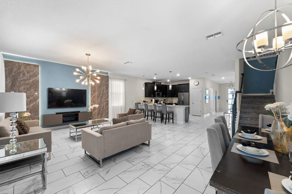 Settle into your stylish, open-concept living space where modern elegance meets comfort. Sleek furnishings and beautiful marble-tiled floors create a sophisticated yet welcoming atmosphere, perfect for unwinding after a day of adventure.