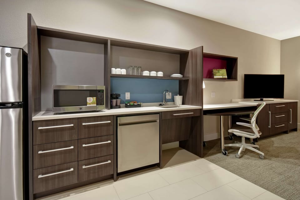 Desk, laptop workspace, cribs (free), rollaway beds (free)