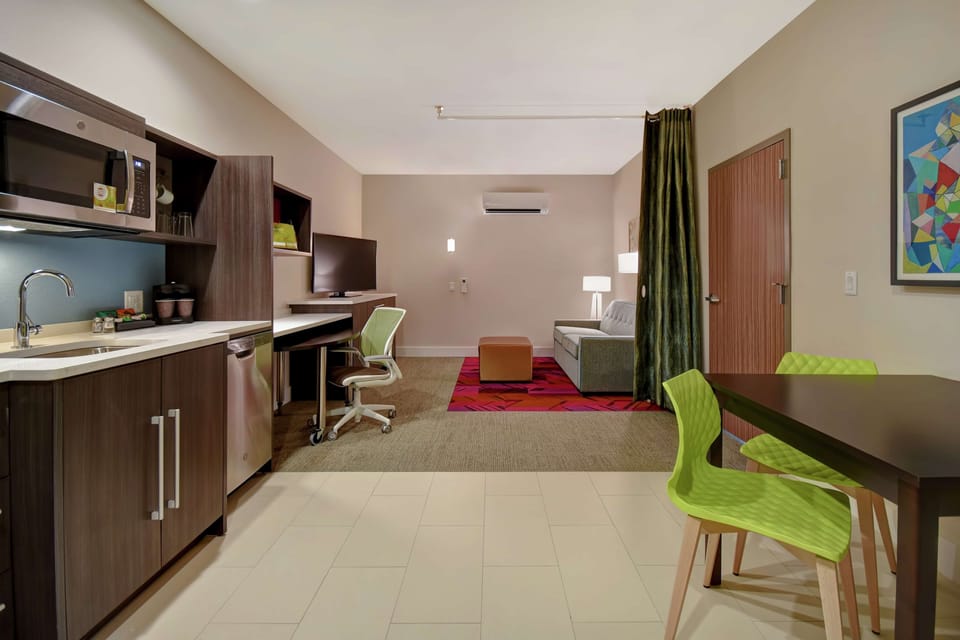 Desk, laptop workspace, cribs (free), rollaway beds (free)
