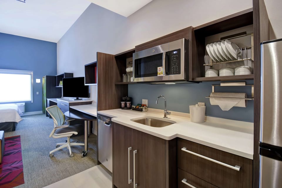 Desk, laptop workspace, cribs (free), rollaway beds (free)