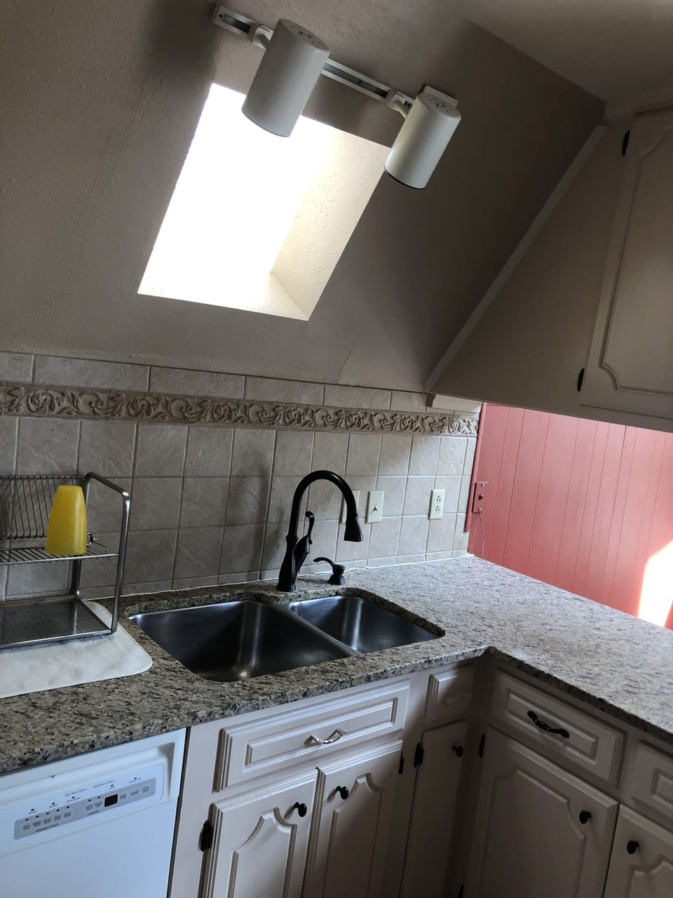 Clean bright kitchen attached to dinning space. 