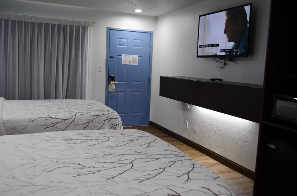 Standard Room, 2 Queen Beds, Non Smoking | Desk, laptop workspace, free WiFi, bed sheets