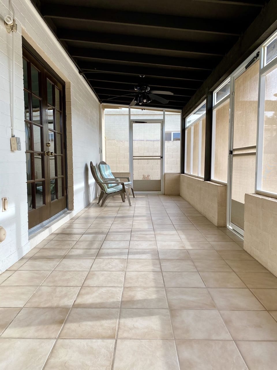 Arizona room - enclosed patio which looks towards the pool