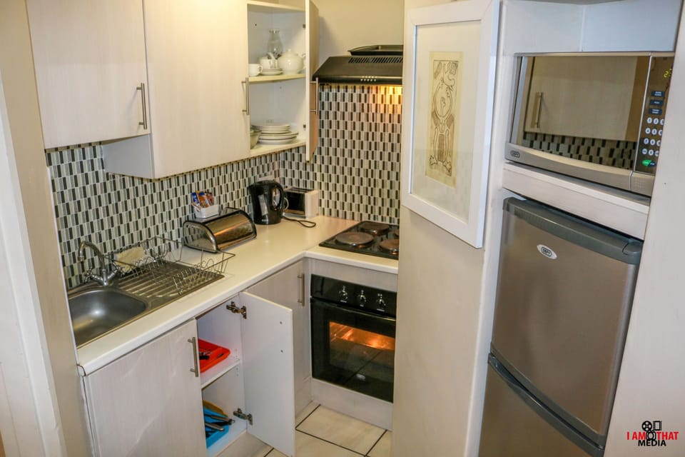 Comfort Apartment | Microwave