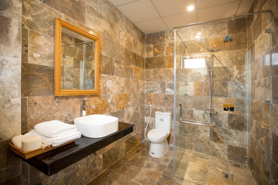 Shower, free toiletries, hair dryer, slippers