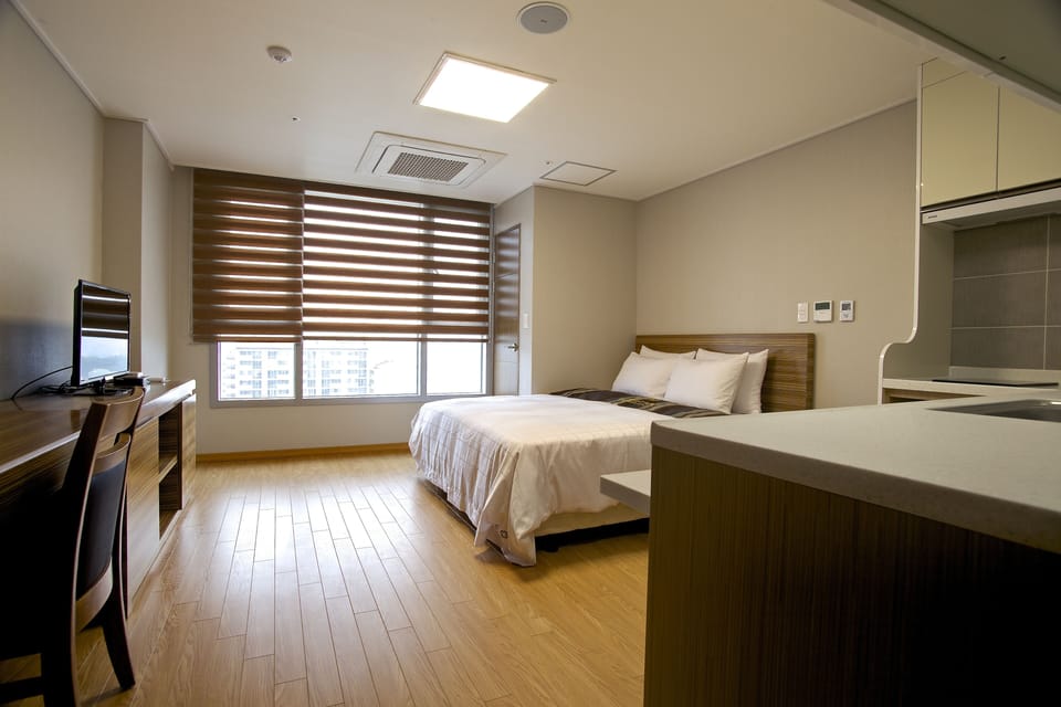 Condo Type(Kitchen) - Superior Family Twin(City View) | Down comforters, desk, laptop workspace, free WiFi