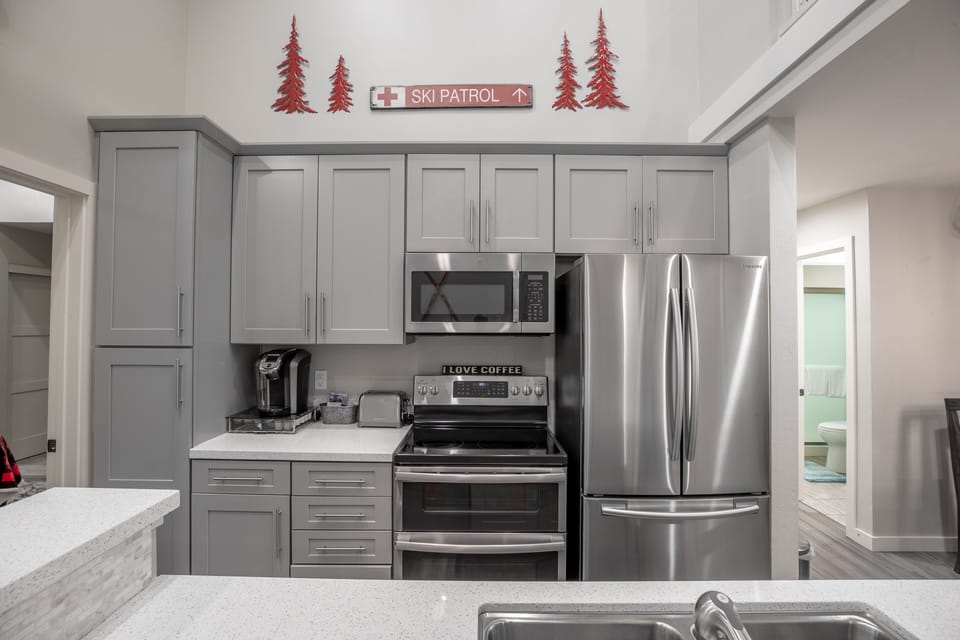 Full Kitchen with dual ovens, dishwasher and fridge with ice maker. 