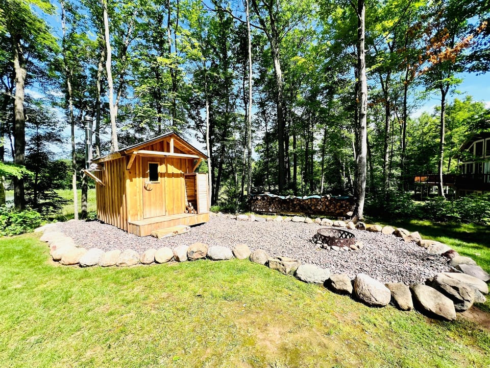 Authentic wood burning sauna and fire pit area