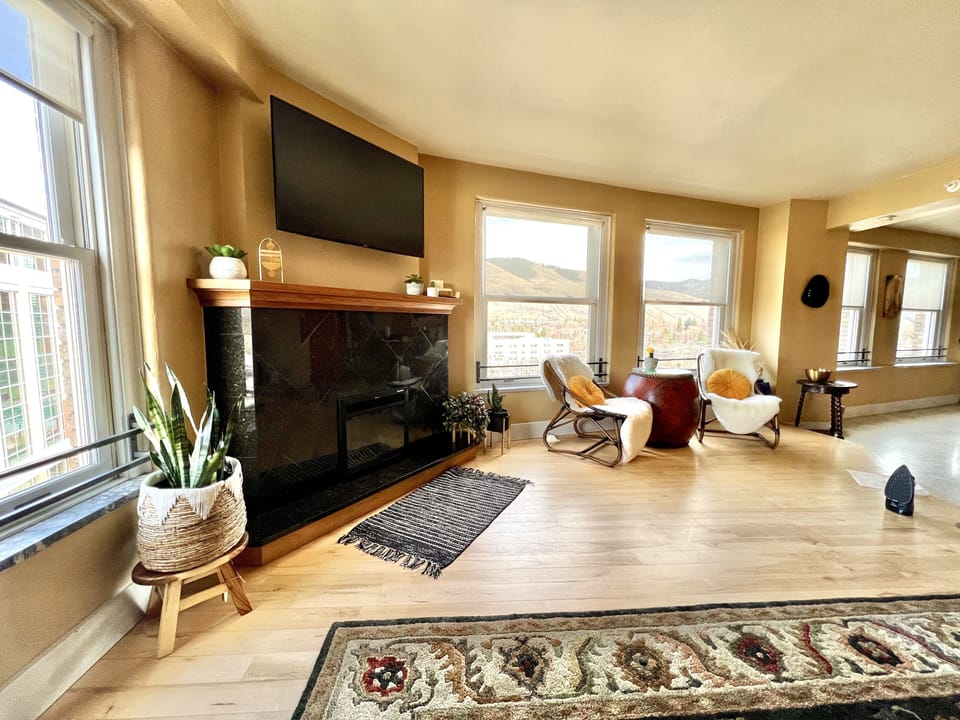 Living room with smart TV and views of the "M" trail on Mount Sentinel.
