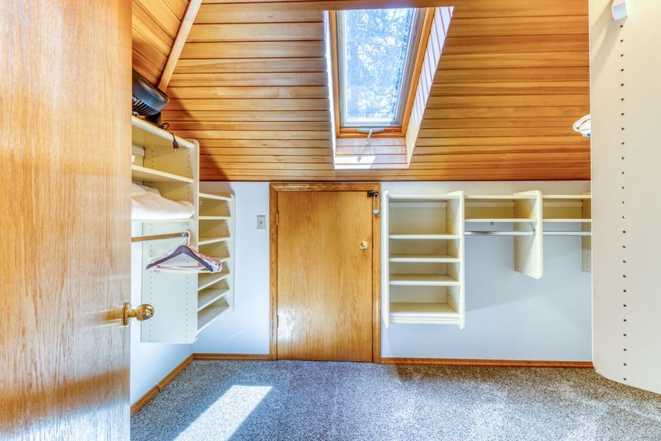 Master loft walk-in closet.  The skylight can be opened for fresh air if desired