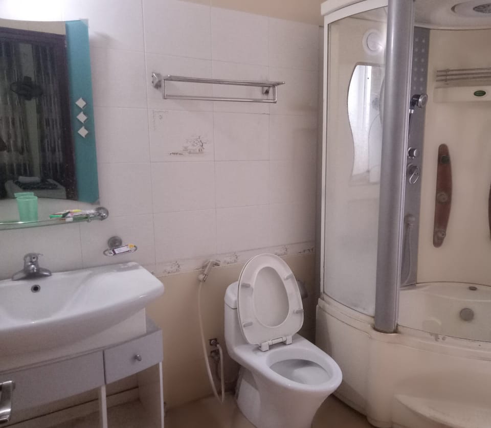 Shower, free toiletries, hair dryer, slippers