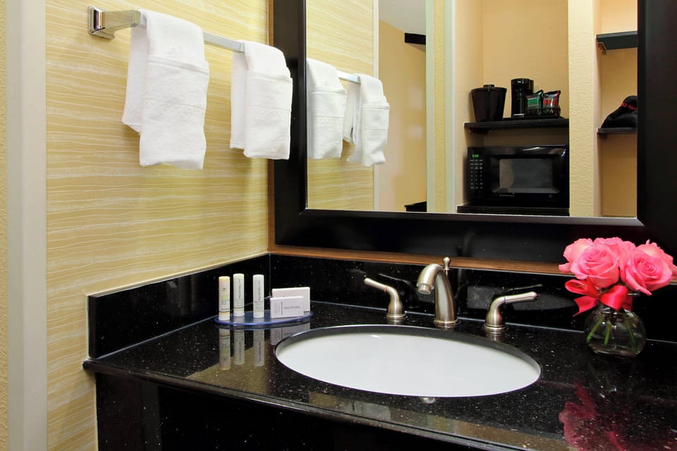 Combined shower/tub, hair dryer, towels, soap
