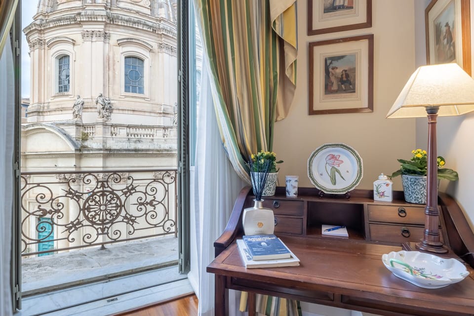 Desk by the master bedroom window offers a serene, sunlit nook for focused work