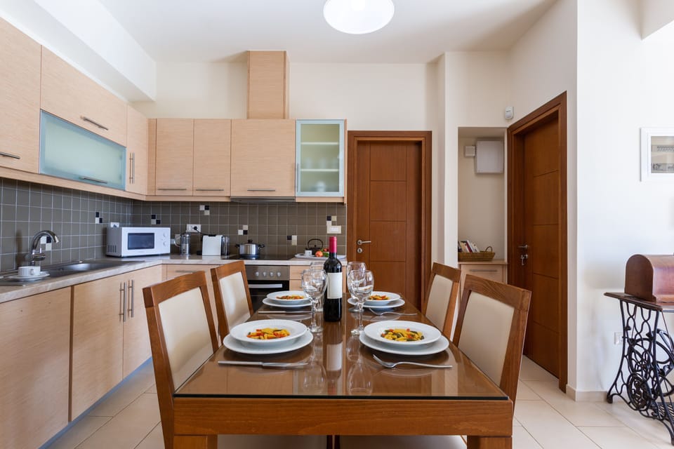 Apartment, Shared Pool  (Spermo) | Private kitchen | Full-size fridge, microwave, oven, stovetop