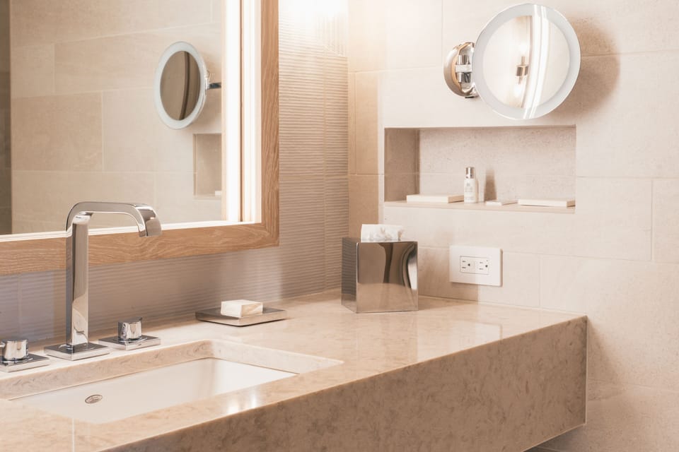 Deluxe Room, 1 King Bed | Bathroom | Shower, hydromassage showerhead, hair dryer, bathrobes
