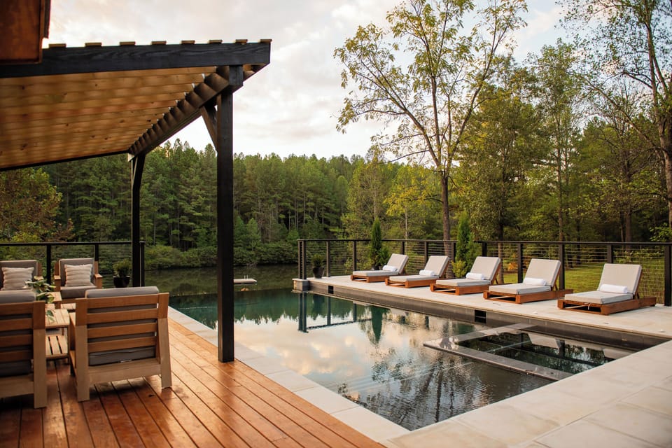 Pool and hot tube with infinity edge overlooking the lake.