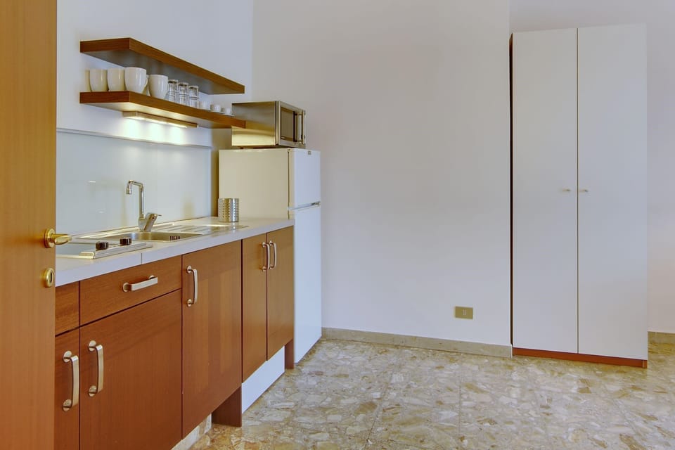 Curb your appetite by cooking a meal in your kitchenette.