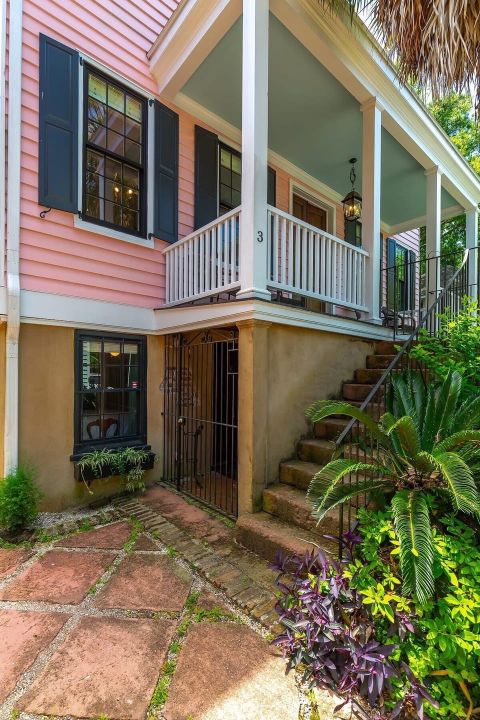 Exterior of the home with one off street parking space