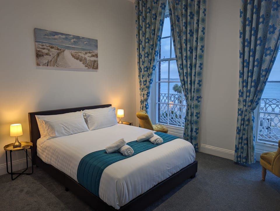 Superior Double Room, Beach View | Desk, laptop workspace, blackout drapes, iron/ironing board