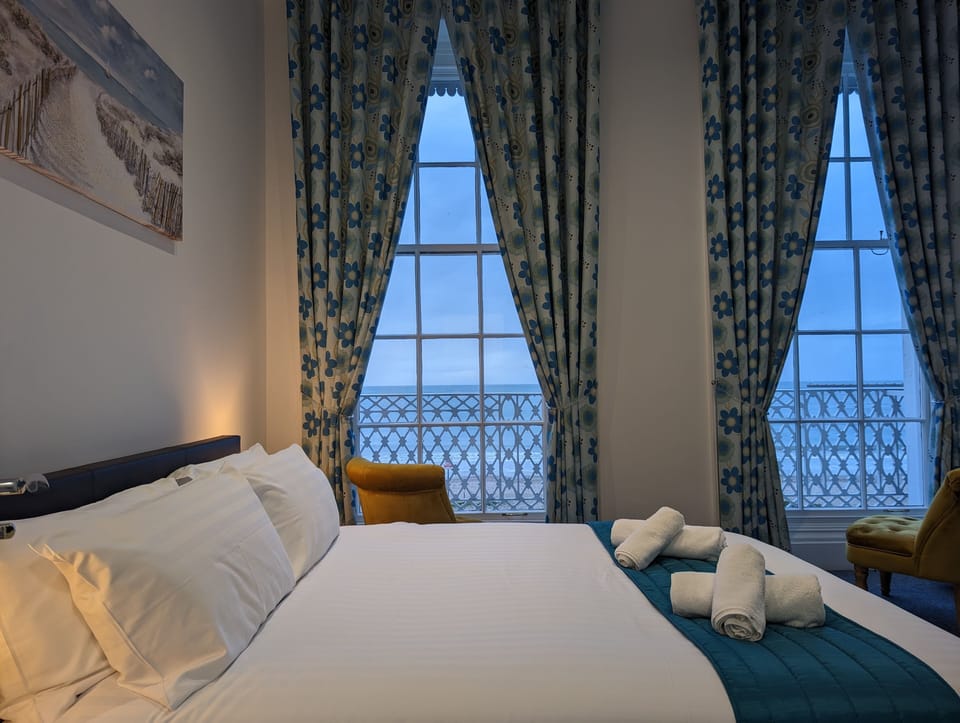 Superior Double Room, Beach View | Desk, laptop workspace, blackout drapes, iron/ironing board